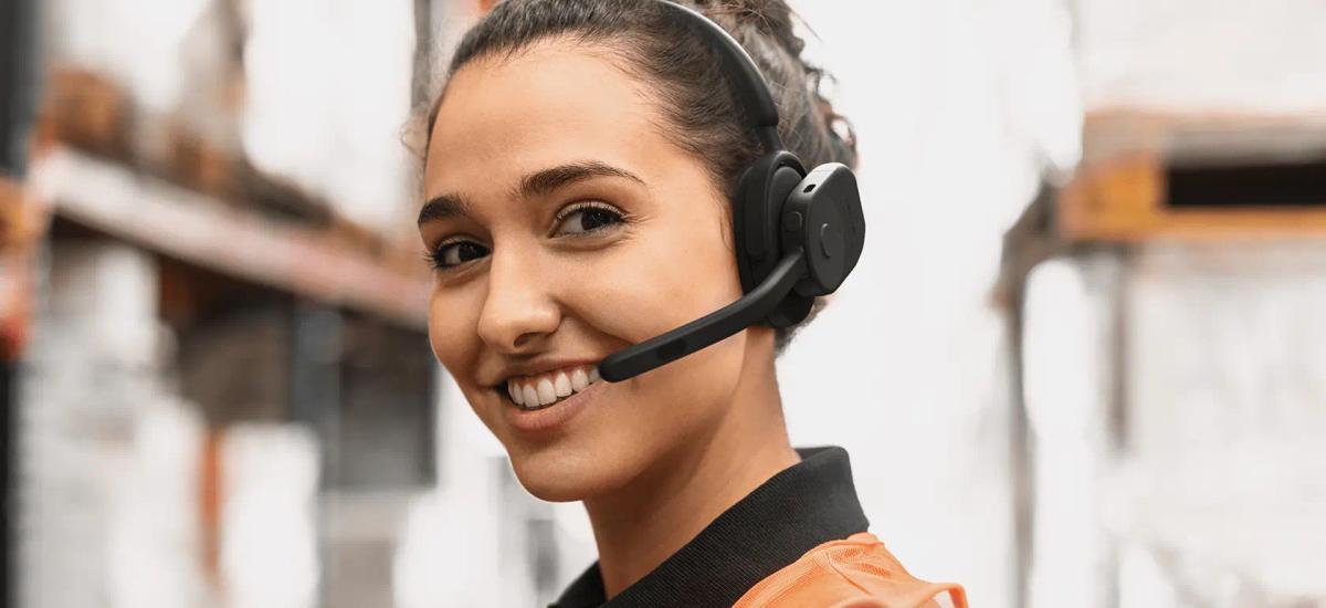 Women using a Jabra perform 75 push to talk headset.
