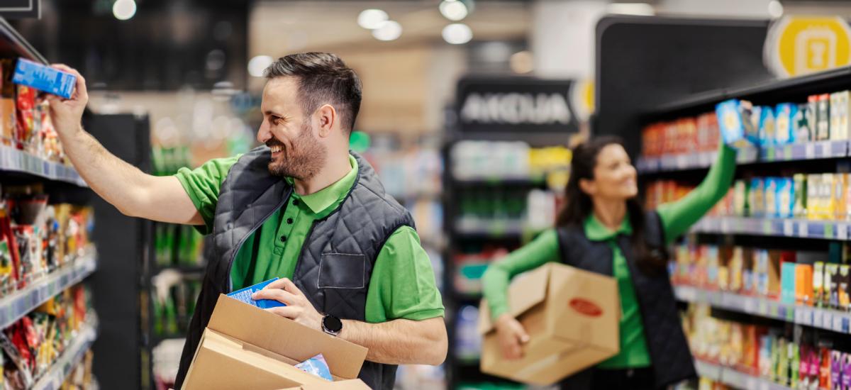 Two retail employees working together in a store.