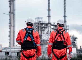 Manufacturing workers standing beside each other