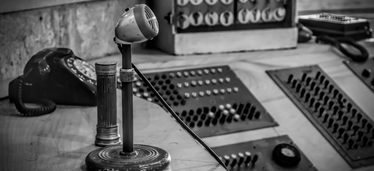 Picture of a security reception and control room in black and white.