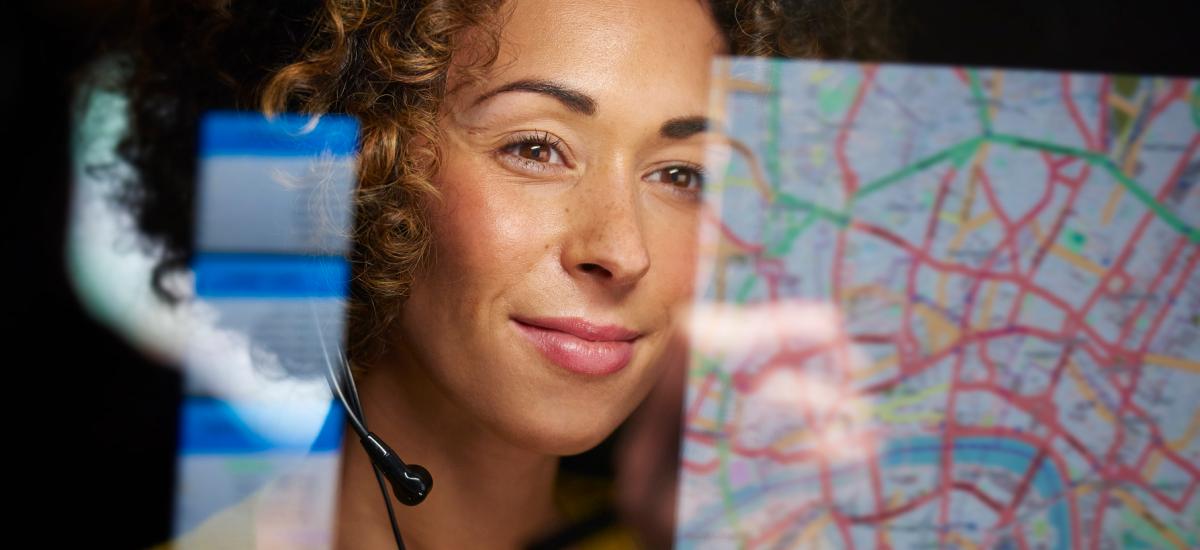 Taxi dispatcher managing fleet and communication using GroupTalk.