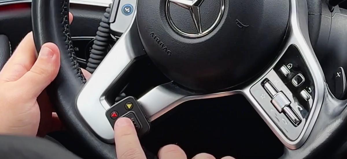 Taxi driver uses push-to-talk button in the car to talk to command and control center