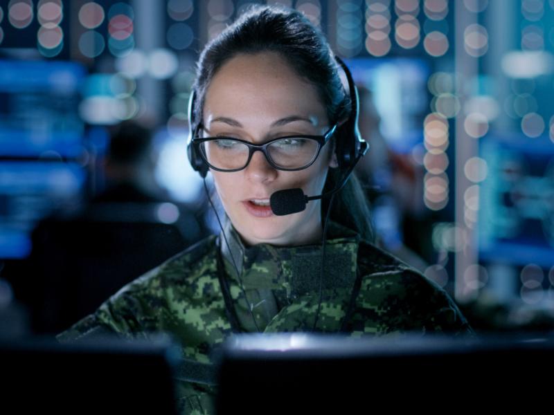 A person is typing on a computer with an illustration showing people communicating in a group